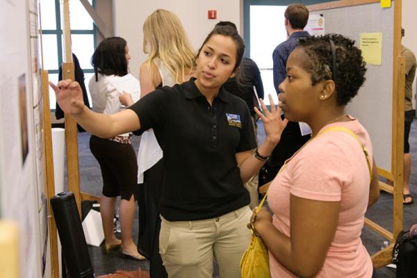 Student presenting her poster